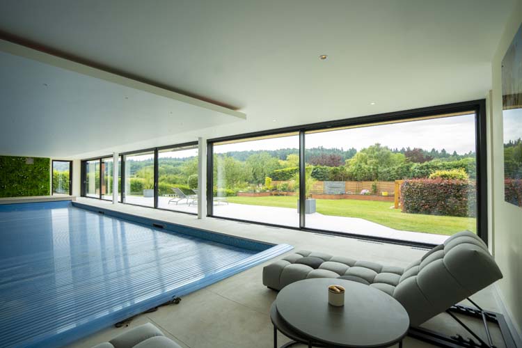 20-metre wide Minimalist Sliding Doors add the Wow Factor to the Arts and Crafts Style Property, Guildford