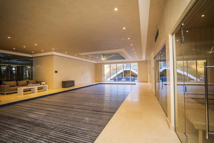 Slim White Bifold Doors for Luxurious Basement Swimming Pool, Virginia Water